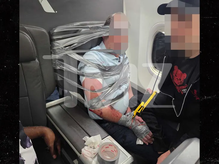 Hombre-atado-con-cinta-adhesiva-al-asiento-de-un-vuelo.jpg